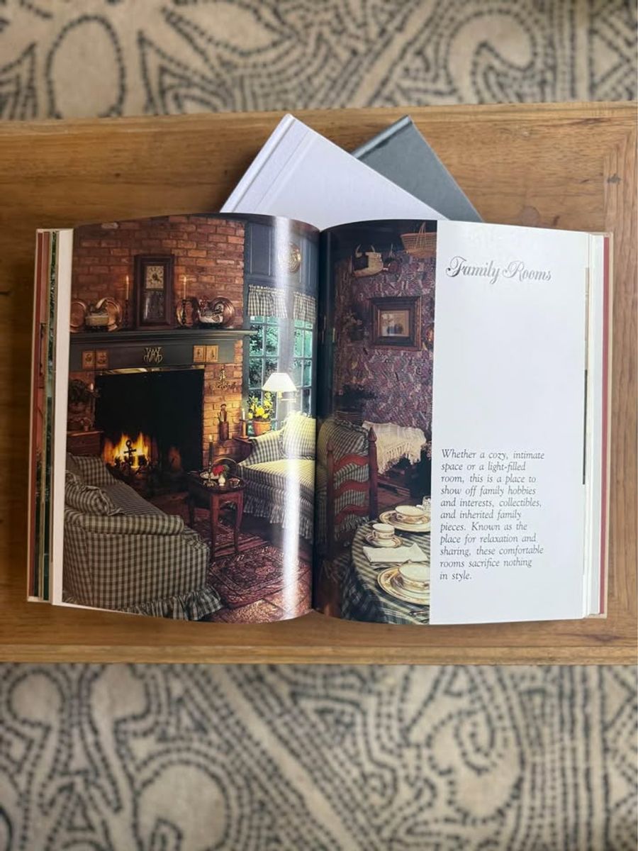 Cream, ivory, warm flax, beige, muted blue-gray, soft taupe undertones, linen-like cloth covers, matte woven texture, subtle gold and metallic lettering, understated traditional styling