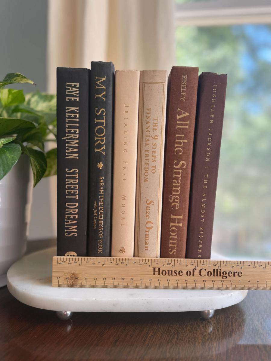 Curated collection of warm brown, olive, tan, and aged neutral books with a traditional library palette.