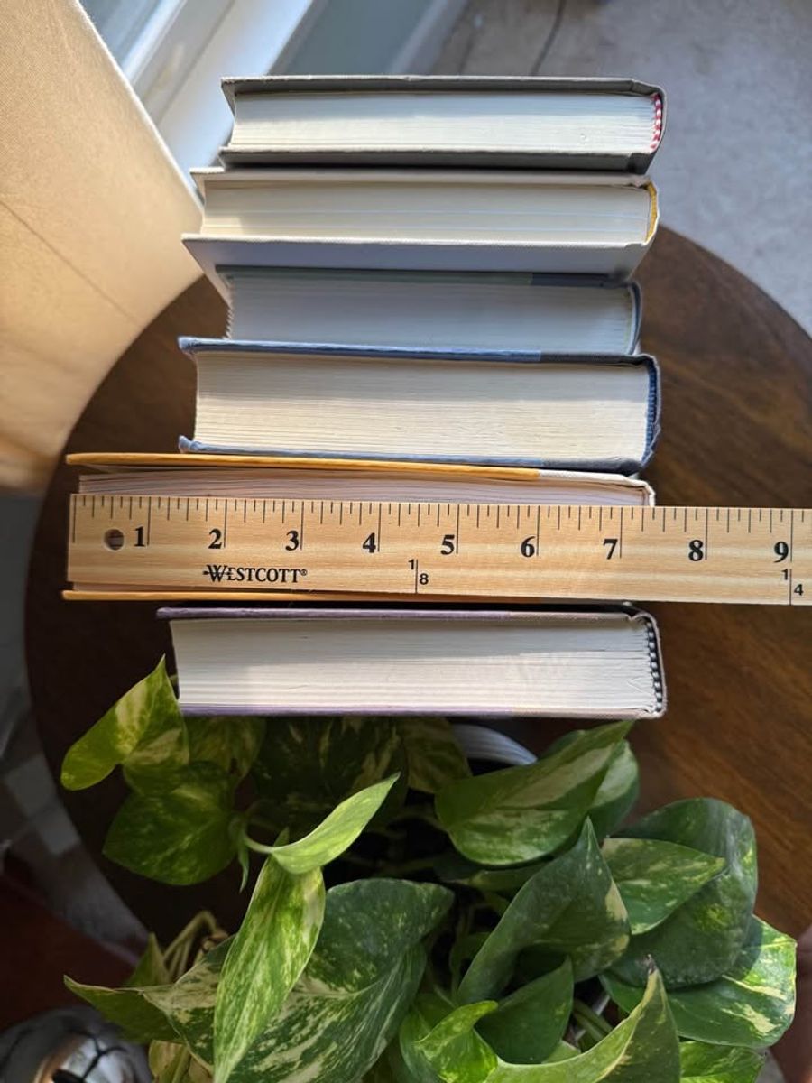 Curated collection of muted blue-gray, slate, charcoal, and softly weathered neutral books.