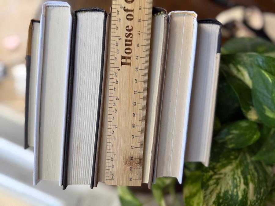 Curated collection of warm brown, olive, tan, and aged neutral books with a traditional library palette.