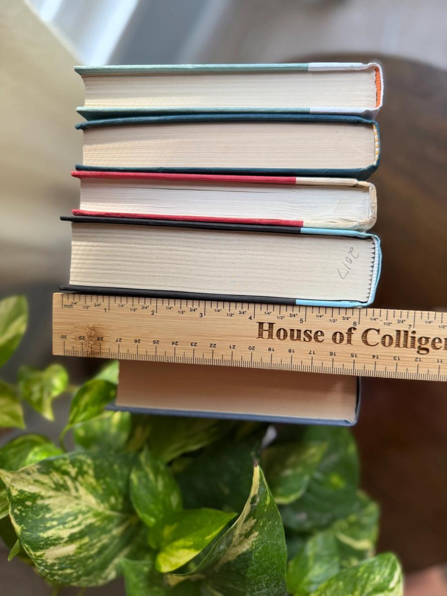 Curated collection of white, pale blue, sand, and soft coastal-neutral books with an airy, sun-faded look.