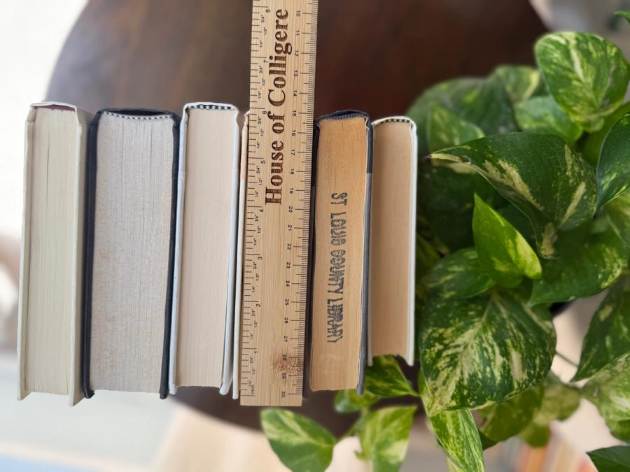 Curated collection of parchment, cream, warm beige, and black books with soft neutral contrast and classic detailing.