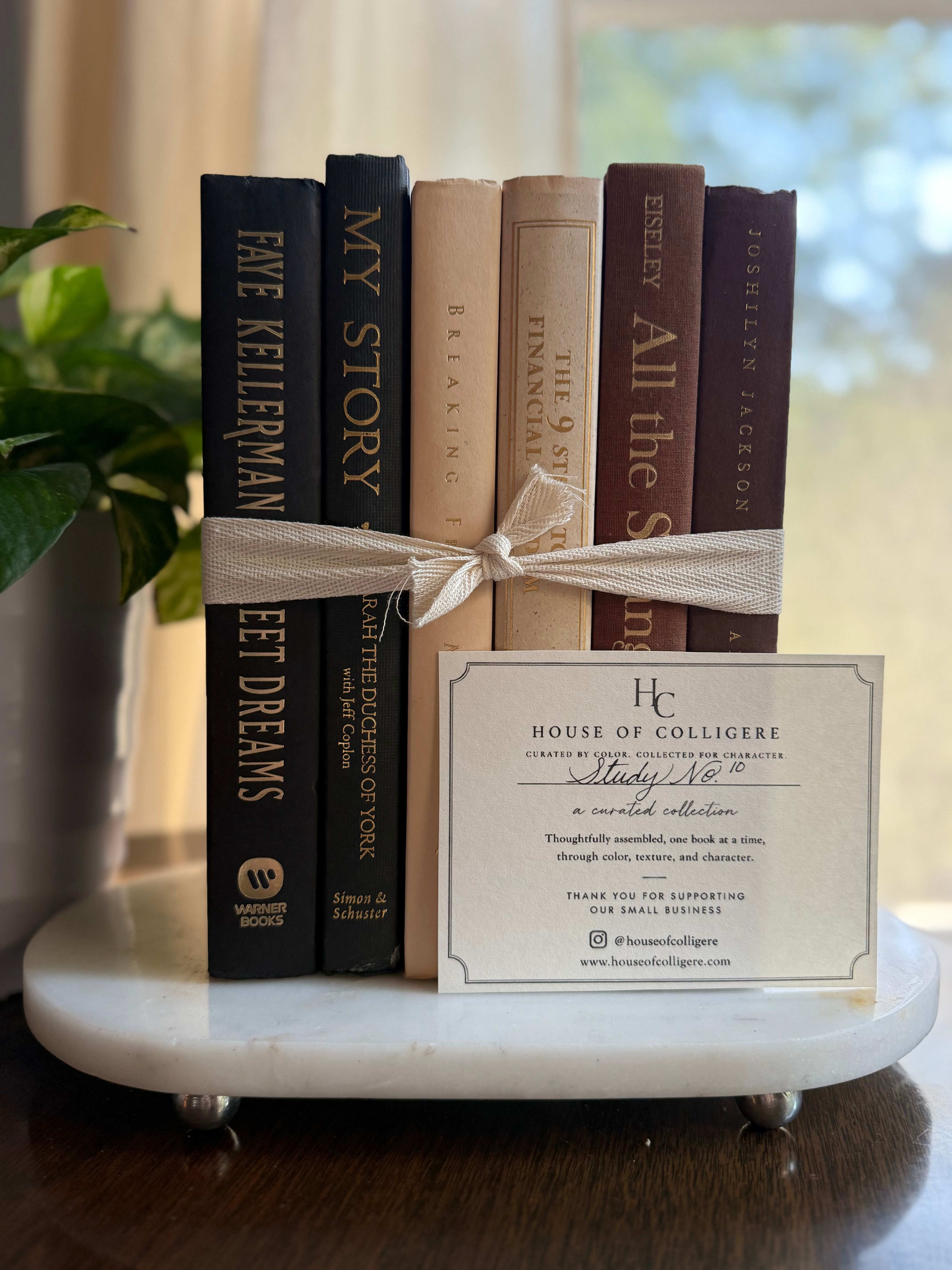 Curated collection of warm brown, olive, tan, and aged neutral books with a traditional library palette.