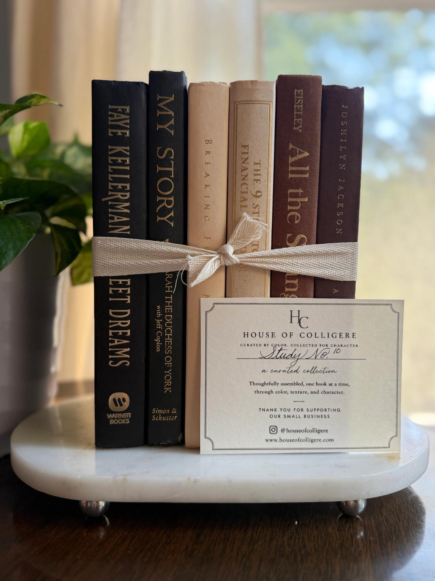 Curated collection of warm brown, olive, tan, and aged neutral books with a traditional library palette.