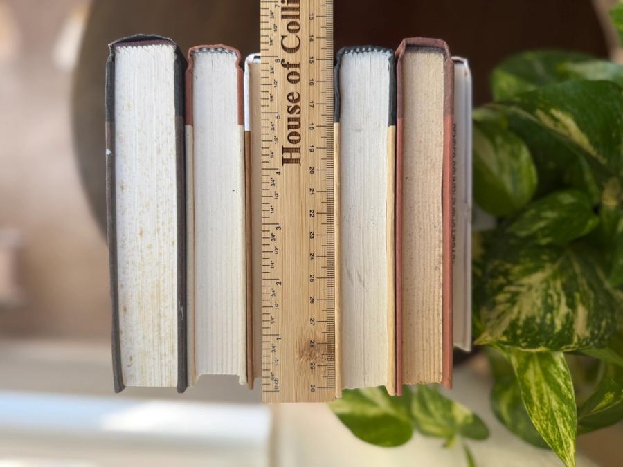 Curated collection of warm brown, olive, tan, and aged neutral books with a traditional library palette.