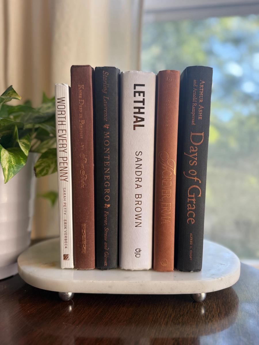 Curated collection of warm brown, olive, tan, and aged neutral books with a traditional library palette.