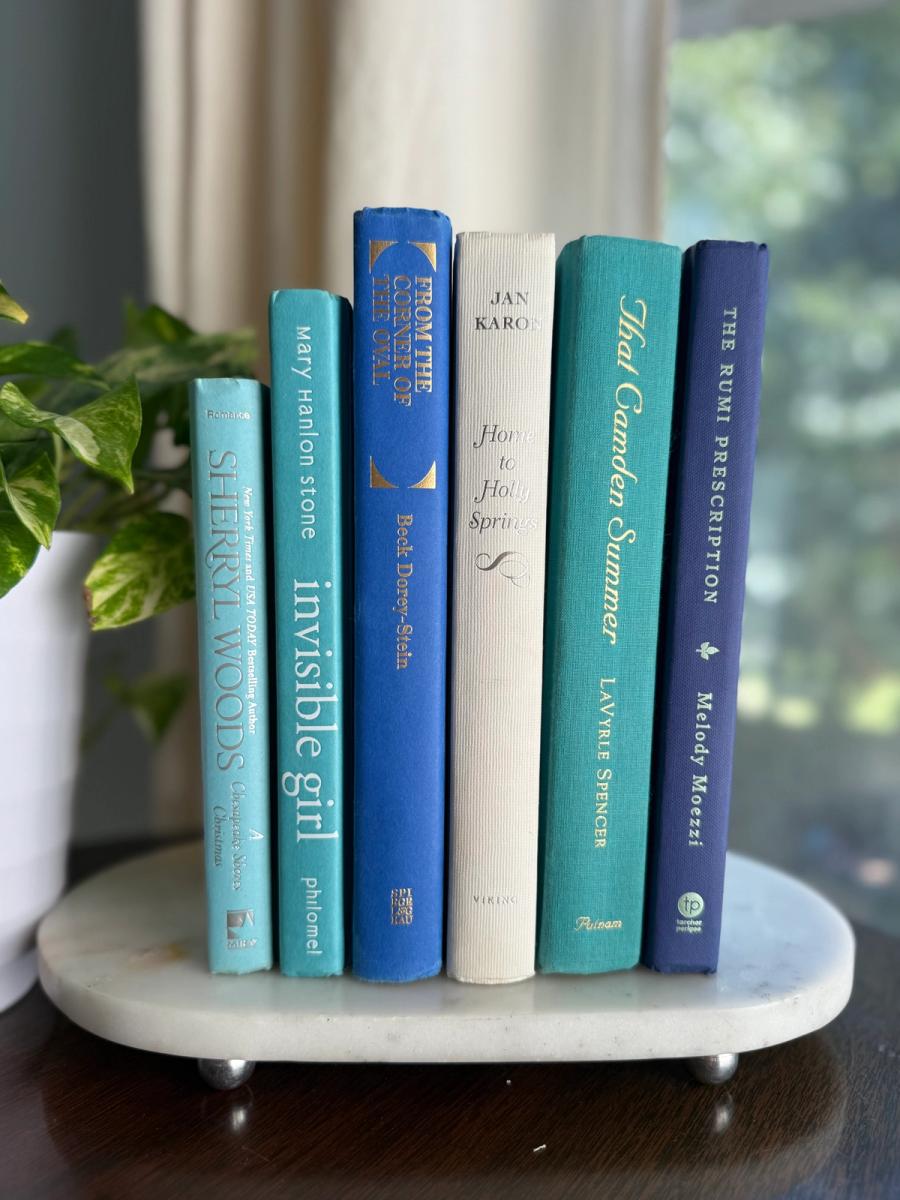 Curated collection of soft blue, aqua, seafoam, and muted coastal-toned books.