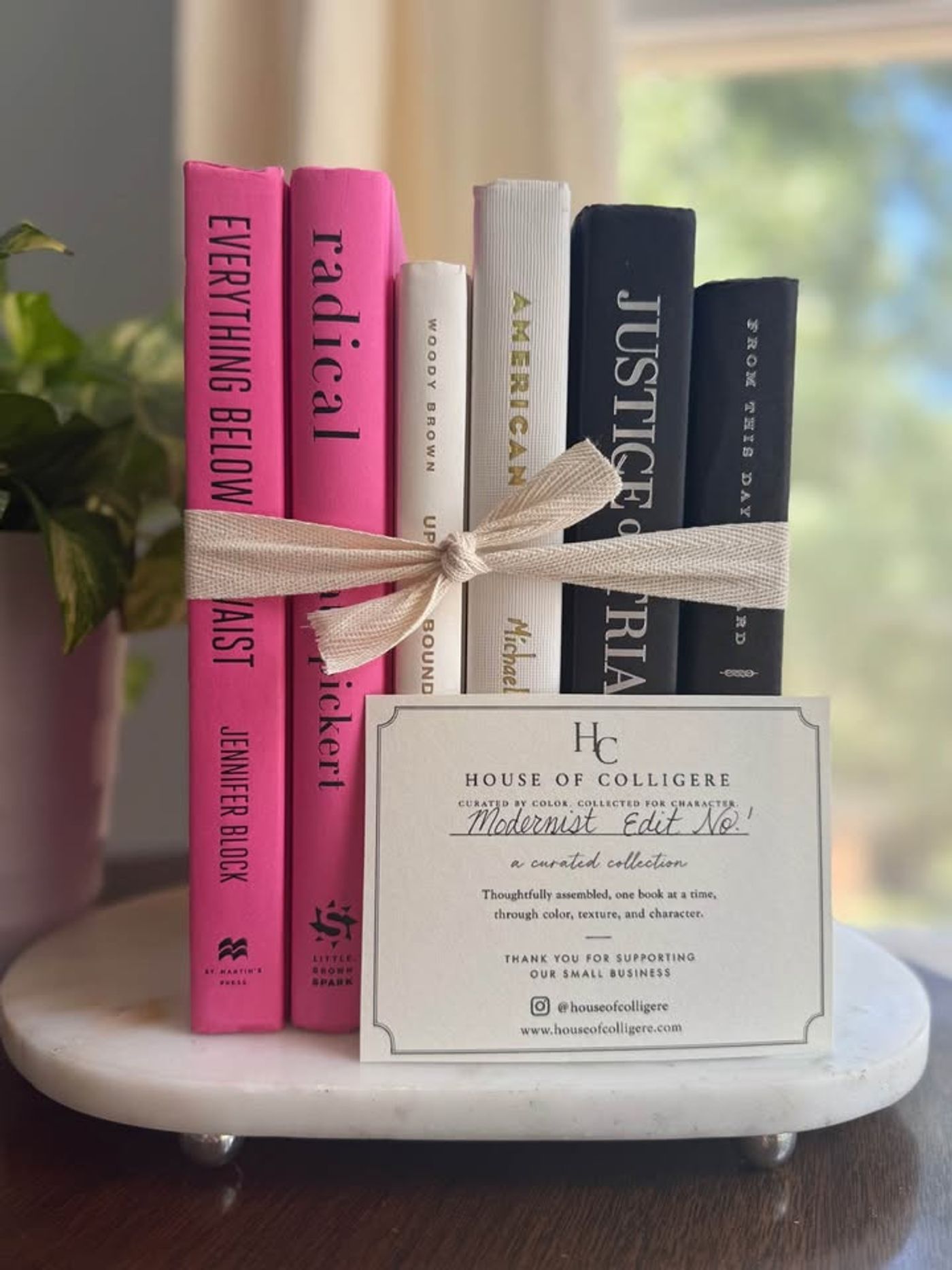 A bold, graphic collection of six hardcover books curated in vivid pink, crisp ivory, and deep black. Clean typography, strong contrast, and varied cloth textures give this one-of-a-kind set a modern, editorial feel. 