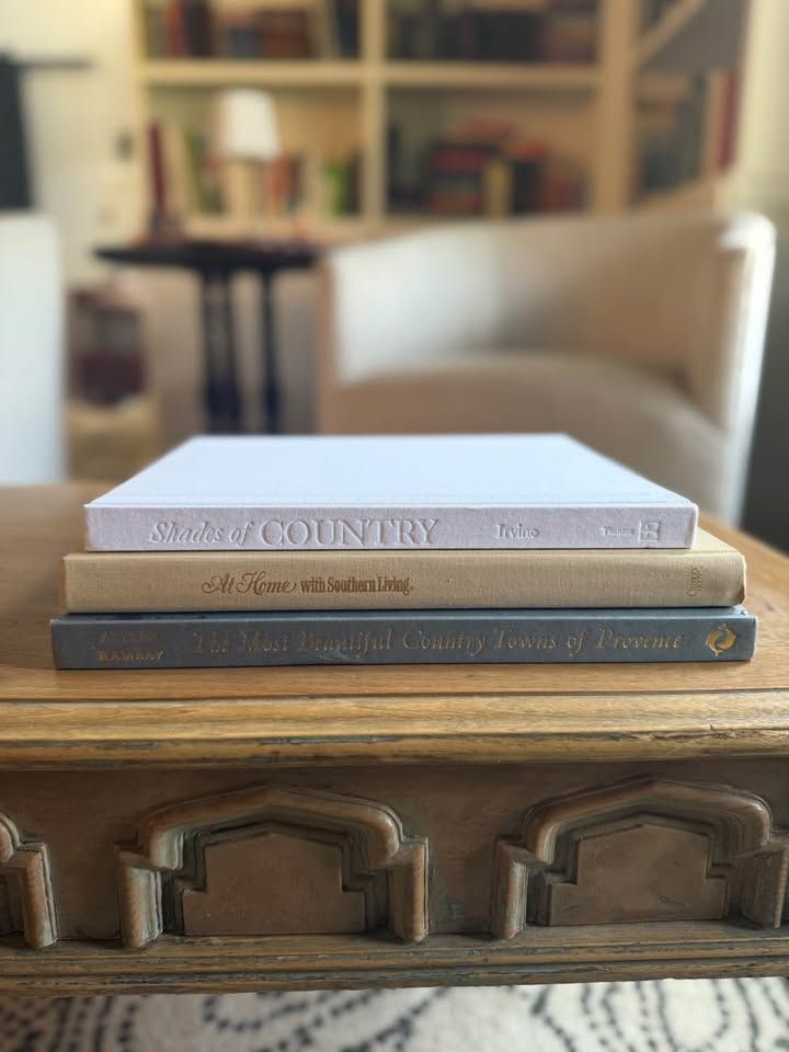 Curated set of oversized hardcover coffee table books selected to work together in scale, color, and visual character.