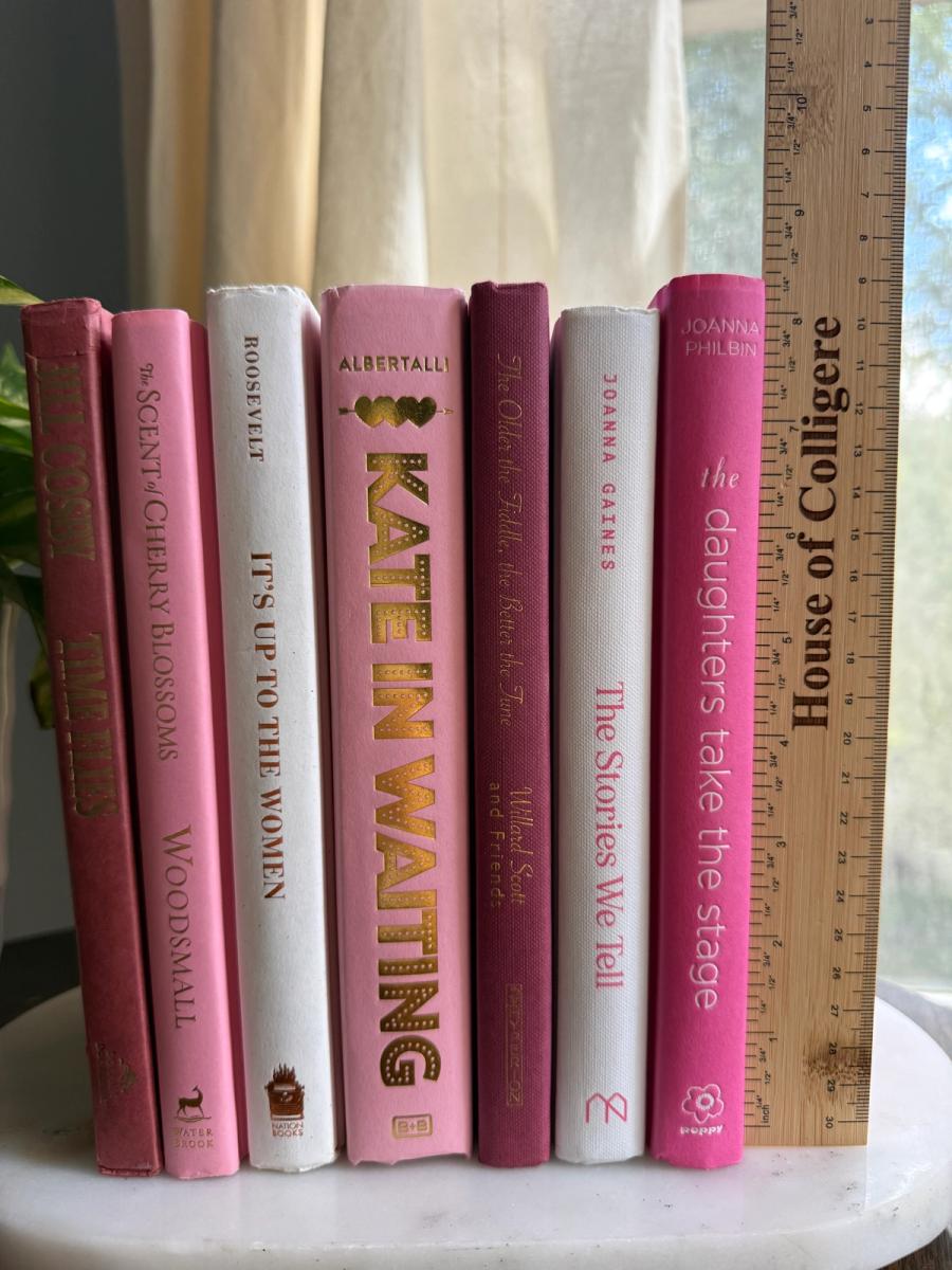 Curated collection of blush, dusty rose, warm taupe, and softly muted neutral books.