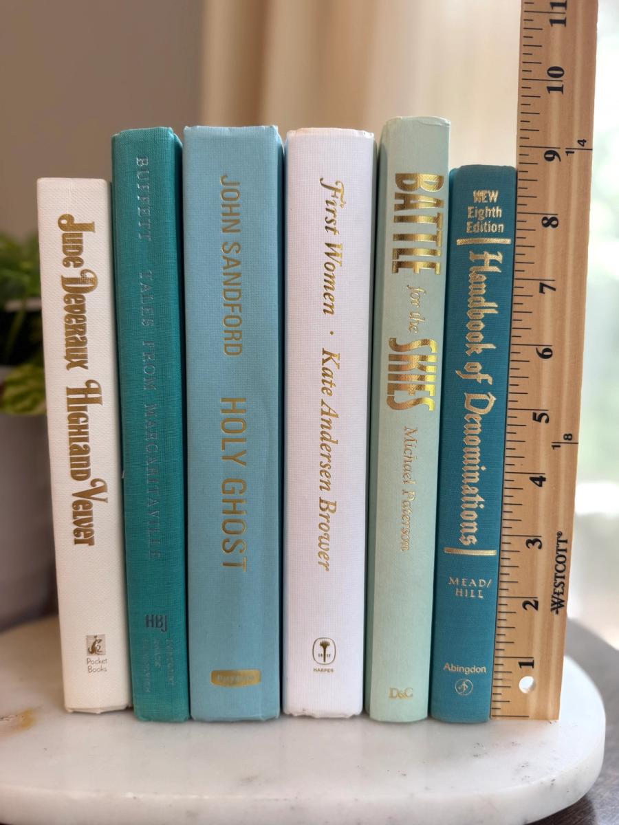 Curated collection of soft blue, aqua, seafoam, and muted coastal-toned books.