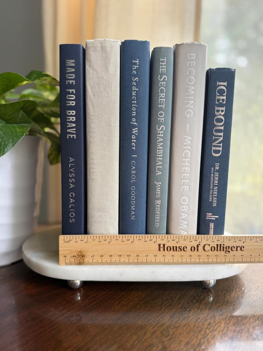 Curated collection of muted blue-gray, slate, charcoal, and softly weathered neutral books.