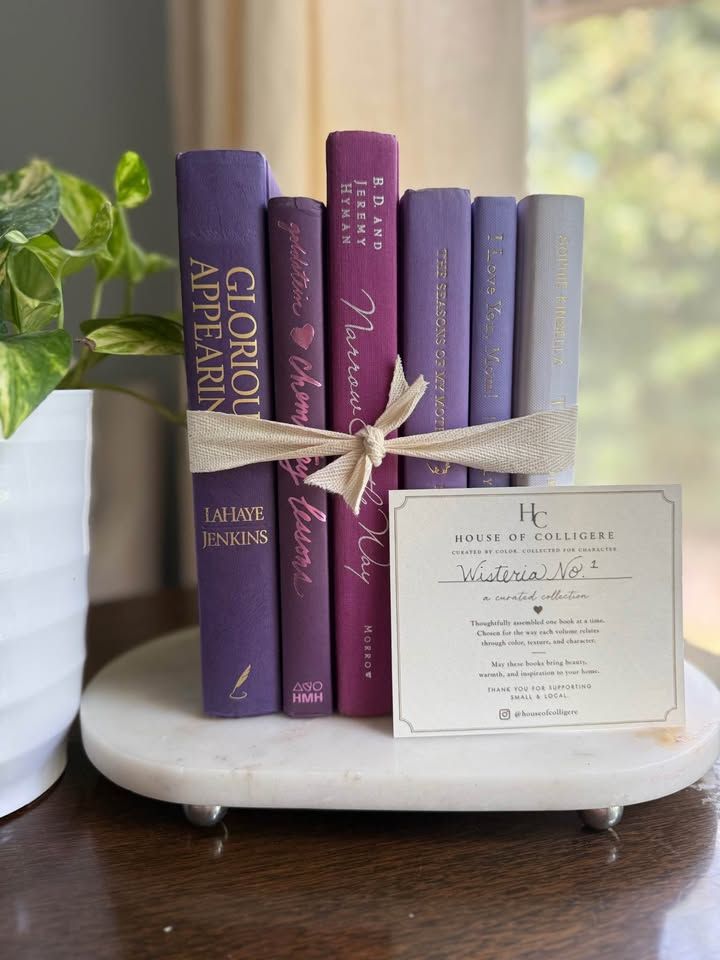Curated collection of lavender, lilac, orchid, and violet books with soft tonal variation and floral-inspired color.