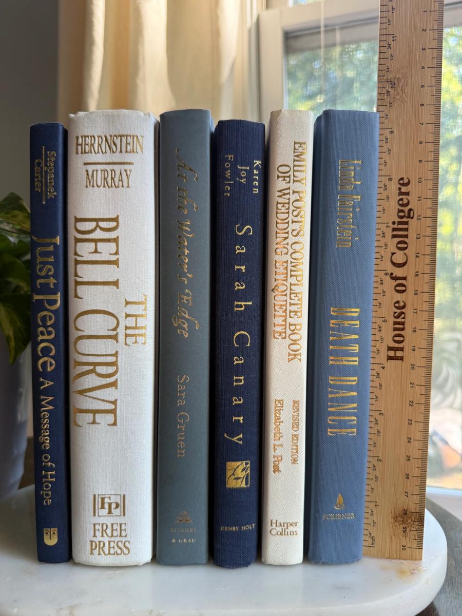 Curated collection of layered blue books ranging from pale coastal blue to deeper ocean tones.