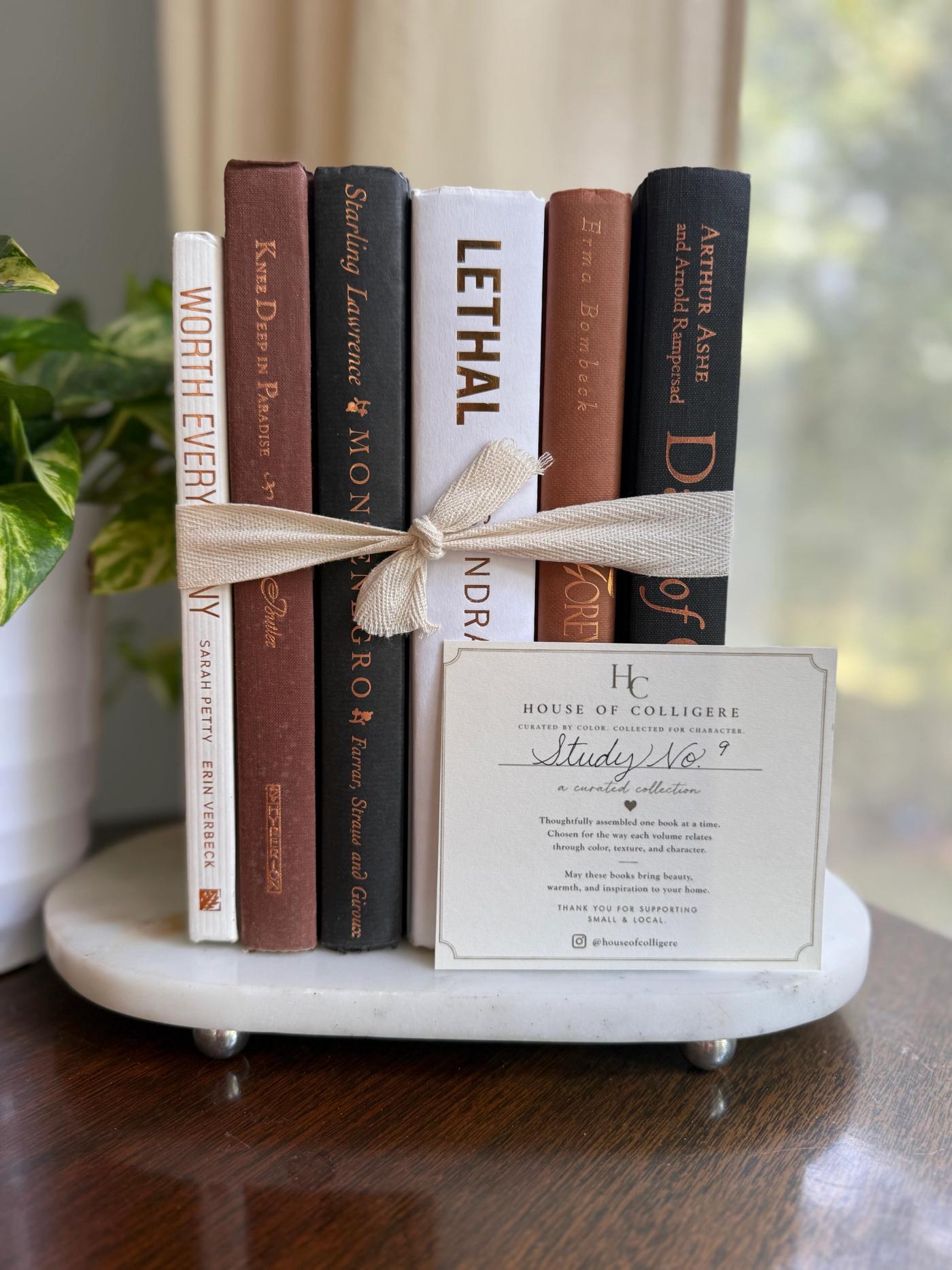 Curated collection of warm brown, olive, tan, and aged neutral books with a traditional library palette.