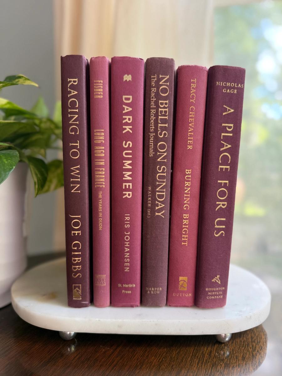 Curated collection of blush, dusty rose, warm taupe, and softly muted neutral books.