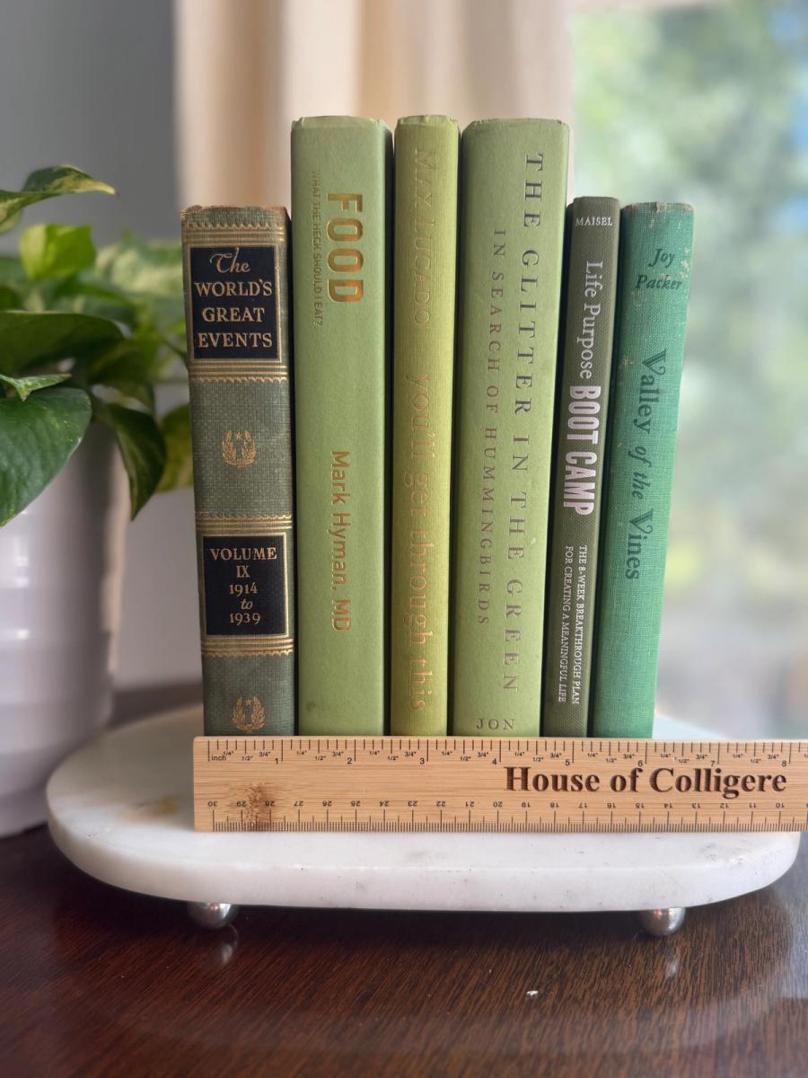 Curated collection of green books ranging from soft sage and olive to deeper botanical tones.