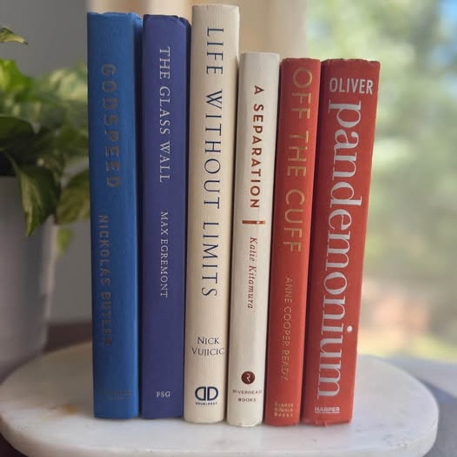 A bold, graphic collection of six hardcover books curated in cobalt blue, deep navy, warm ivory, and coral orange. Strong typography, saturated color, and varied cloth textures give this collection a clean, modern character.