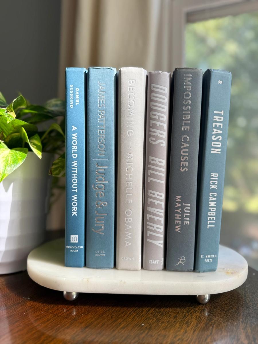 Curated collection of muted blue-gray, slate, charcoal, and softly weathered neutral books.