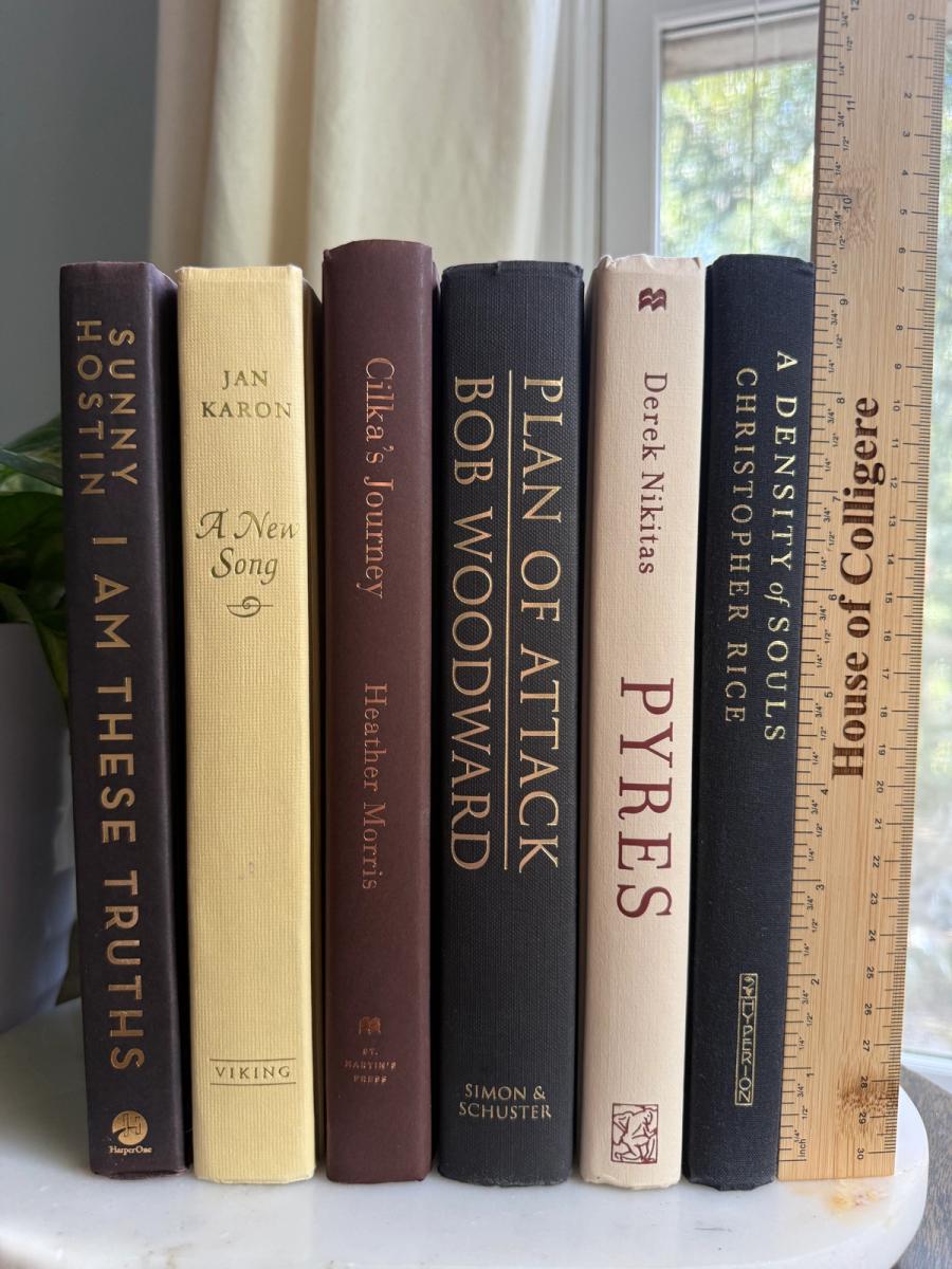 Curated collection of warm brown, olive, tan, and aged neutral books with a traditional library palette.