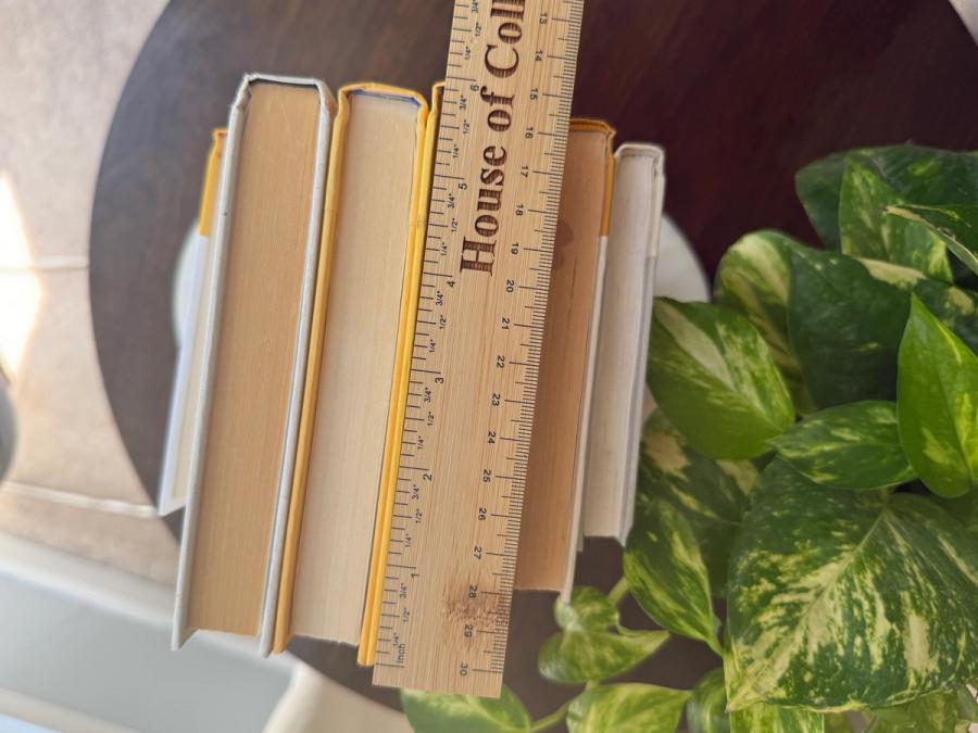 Six curated hardcover books in mustard yellow, golden ochre, cream, and soft white tones, tied with natural linen ribbon and displayed with a House of Colligere Modernist Edit No. 5 card.