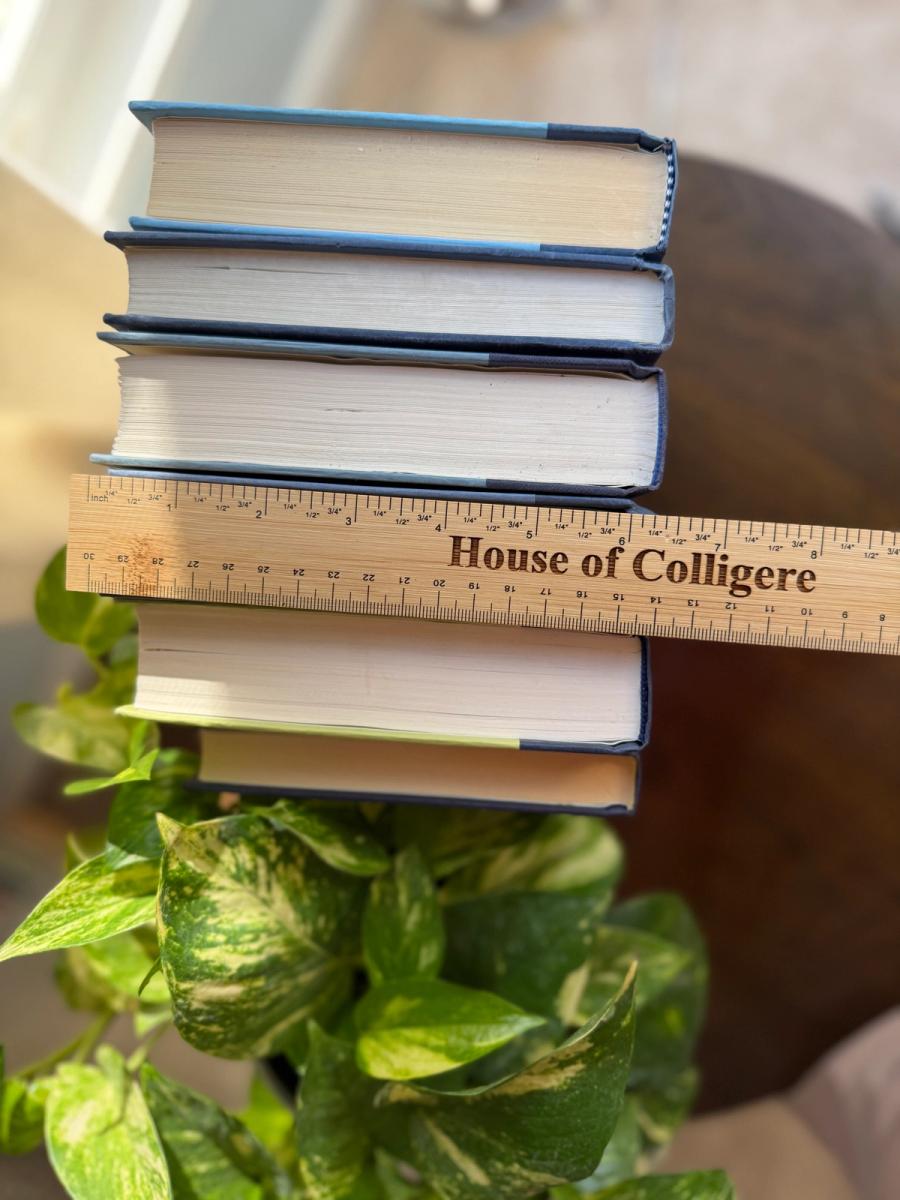 Curated collection of deep navy, warm ivory, brown, and gold-accented books with classic traditional character.