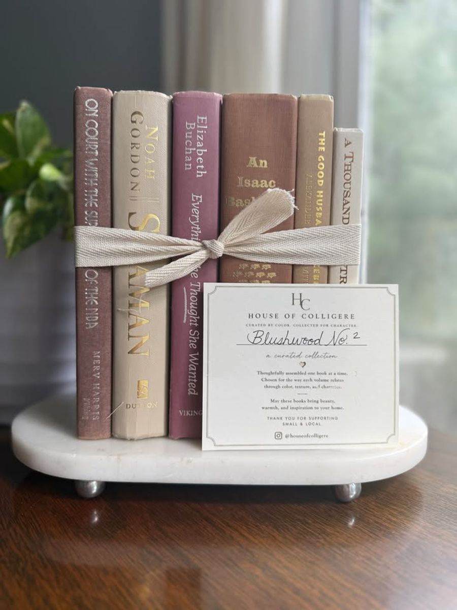 Curated collection of blush, dusty rose, warm taupe, and softly muted neutral books.