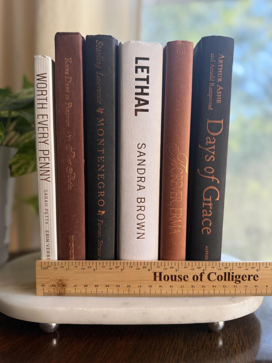 Curated collection of warm brown, olive, tan, and aged neutral books with a traditional library palette.
