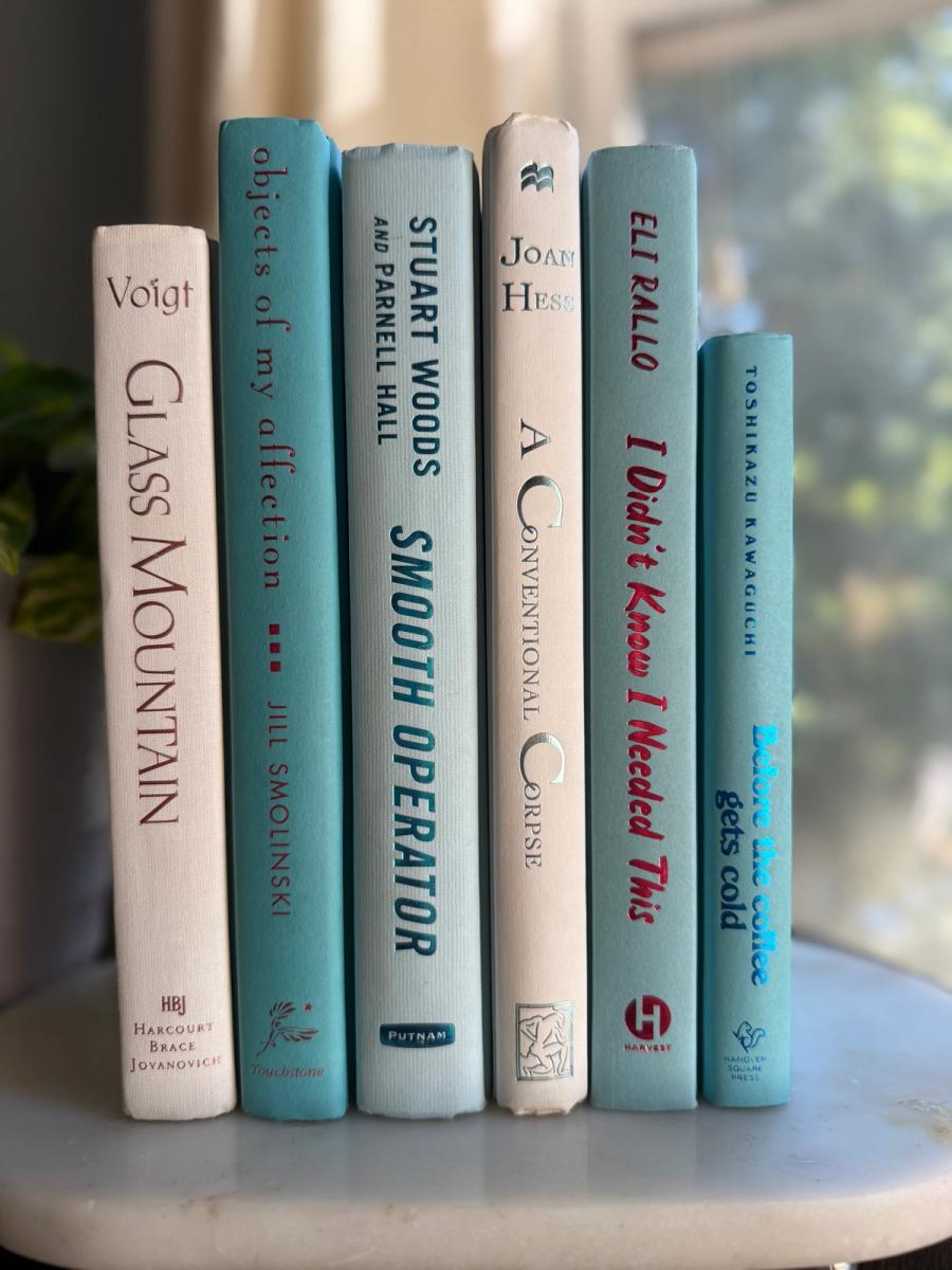 Curated collection of soft blue, aqua, seafoam, and muted coastal-toned books.