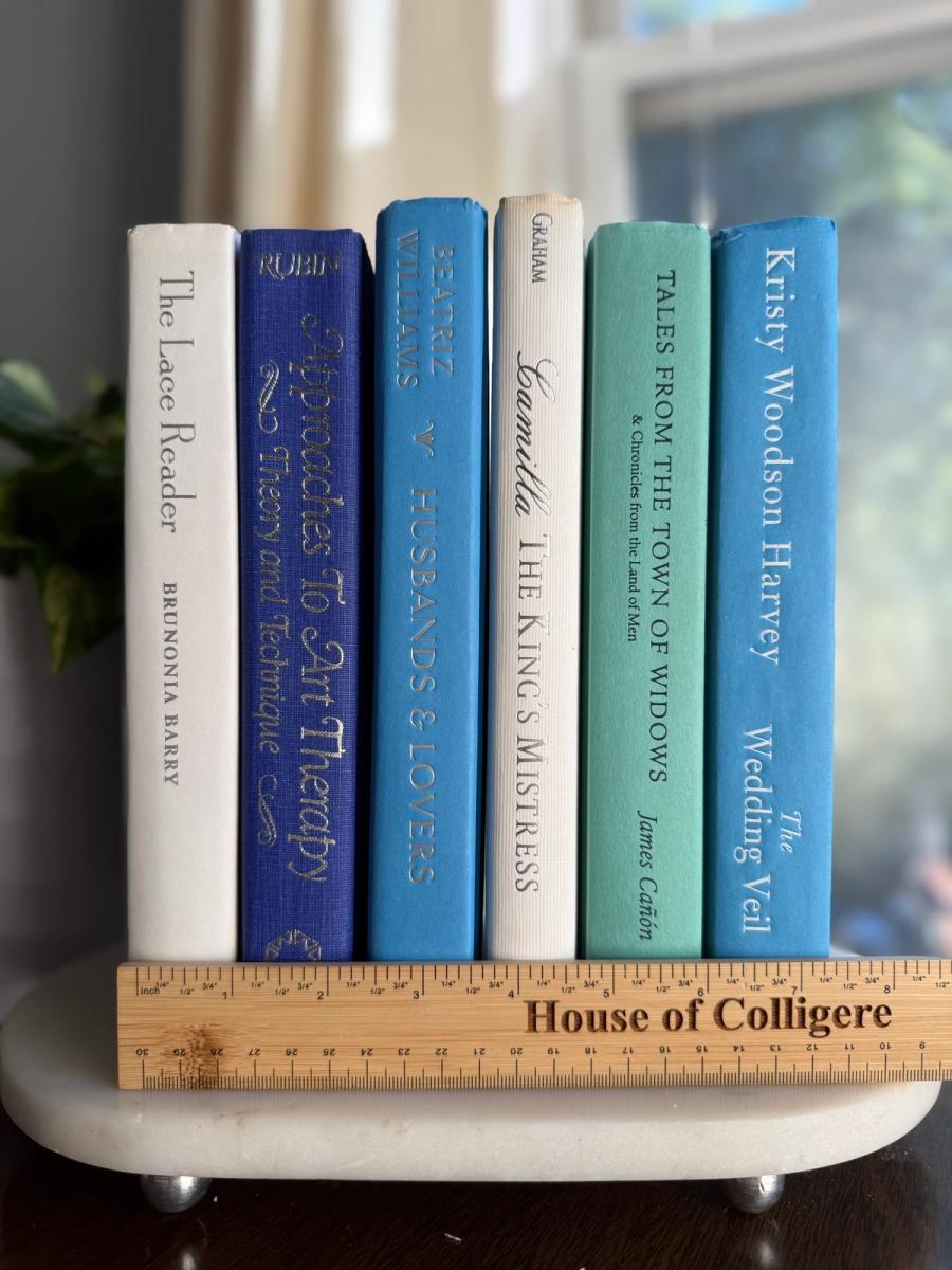 Curated collection of soft blue, aqua, seafoam, and muted coastal-toned books.