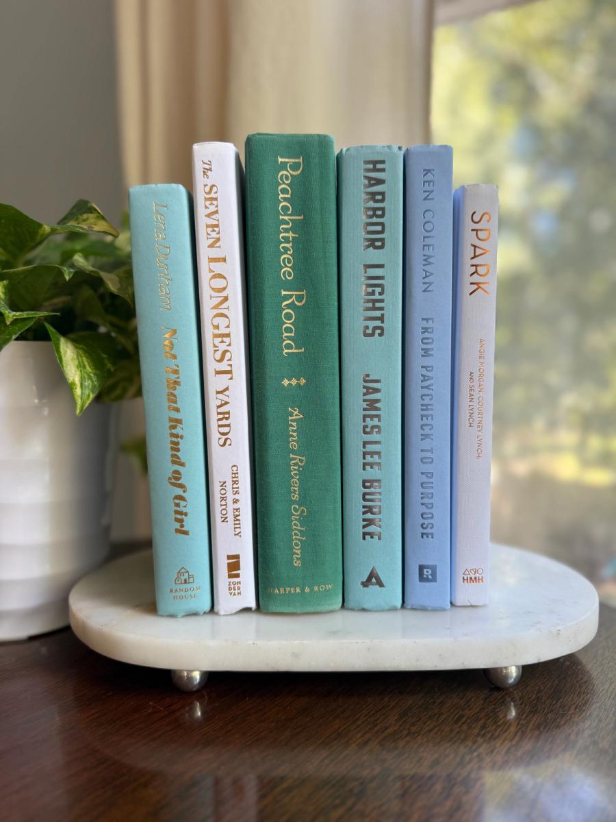 Curated collection of soft blue, aqua, seafoam, and muted coastal-toned books.