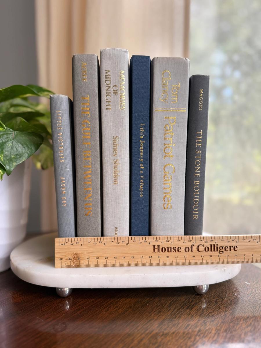 Curated collection of muted blue-gray, slate, charcoal, and softly weathered neutral books.