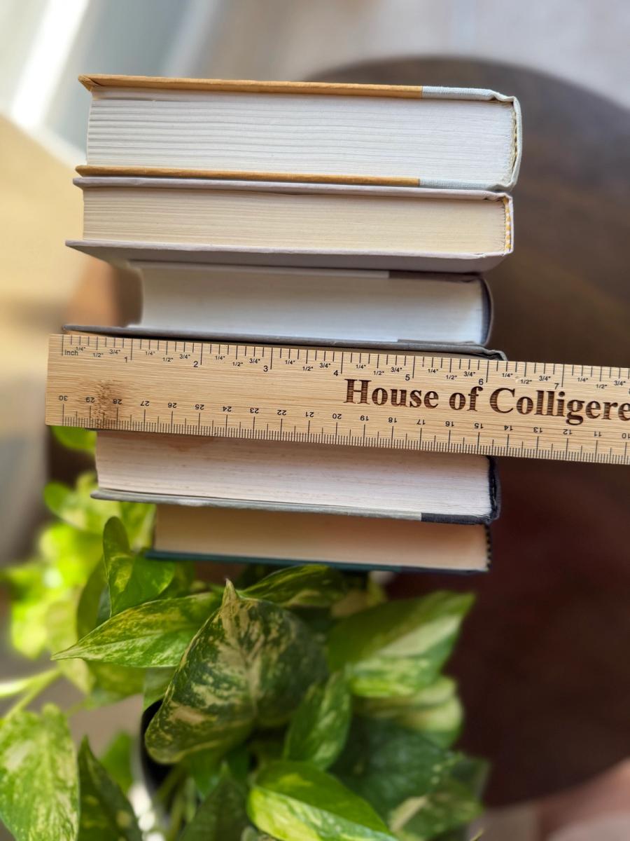 Curated collection of warm brown, olive, tan, and aged neutral books with a traditional library palette.