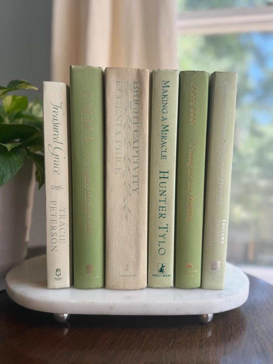 Curated collection of green books ranging from soft sage and olive to deeper botanical tones.