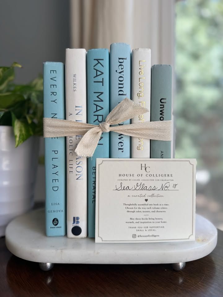 Curated collection of soft blue, aqua, seafoam, and muted coastal-toned books.