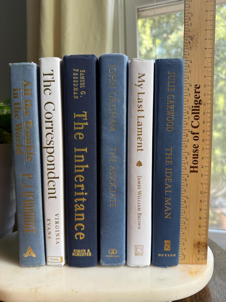 Curated collection of layered blue books ranging from pale coastal blue to deeper ocean tones.