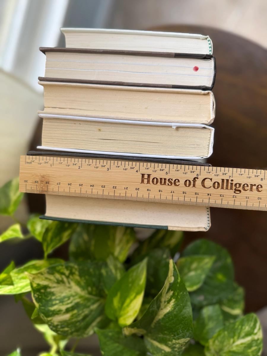 Curated collection of parchment, cream, warm beige, and black books with soft neutral contrast and classic detailing.