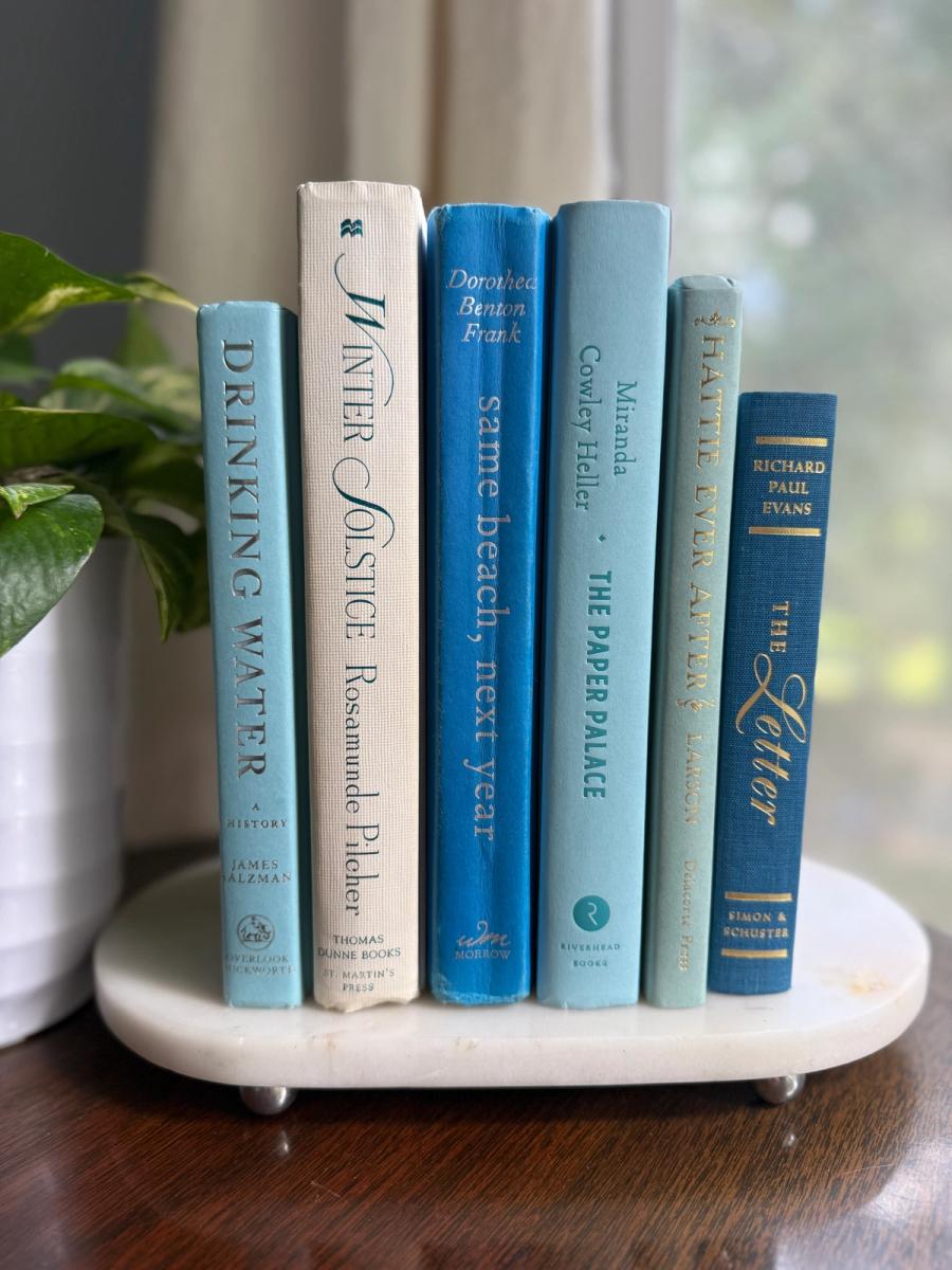 Curated collection of soft blue, aqua, seafoam, and muted coastal-toned books.