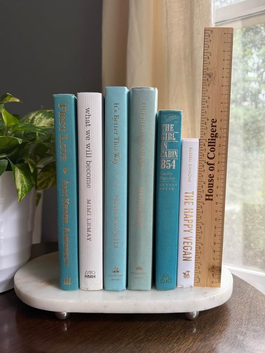 Curated collection of soft blue, aqua, seafoam, and muted coastal-toned books.