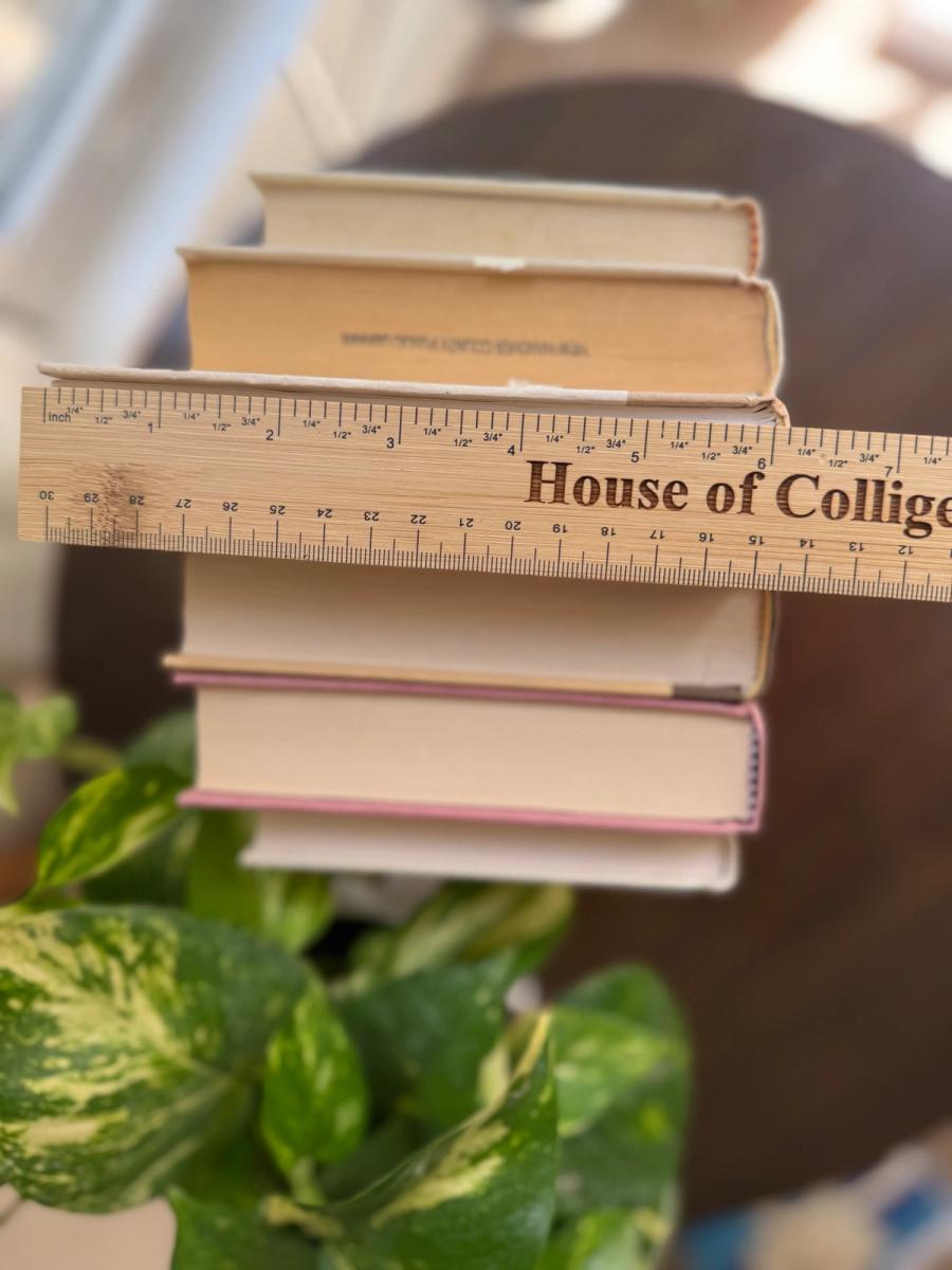 Curated collection of blush, dusty rose, warm taupe, and softly muted neutral books.
