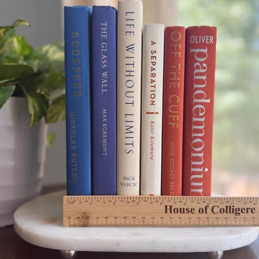 A bold, graphic collection of six hardcover books curated in cobalt blue, deep navy, warm ivory, and coral orange. Strong typography, saturated color, and varied cloth textures give this collection a clean, modern character.