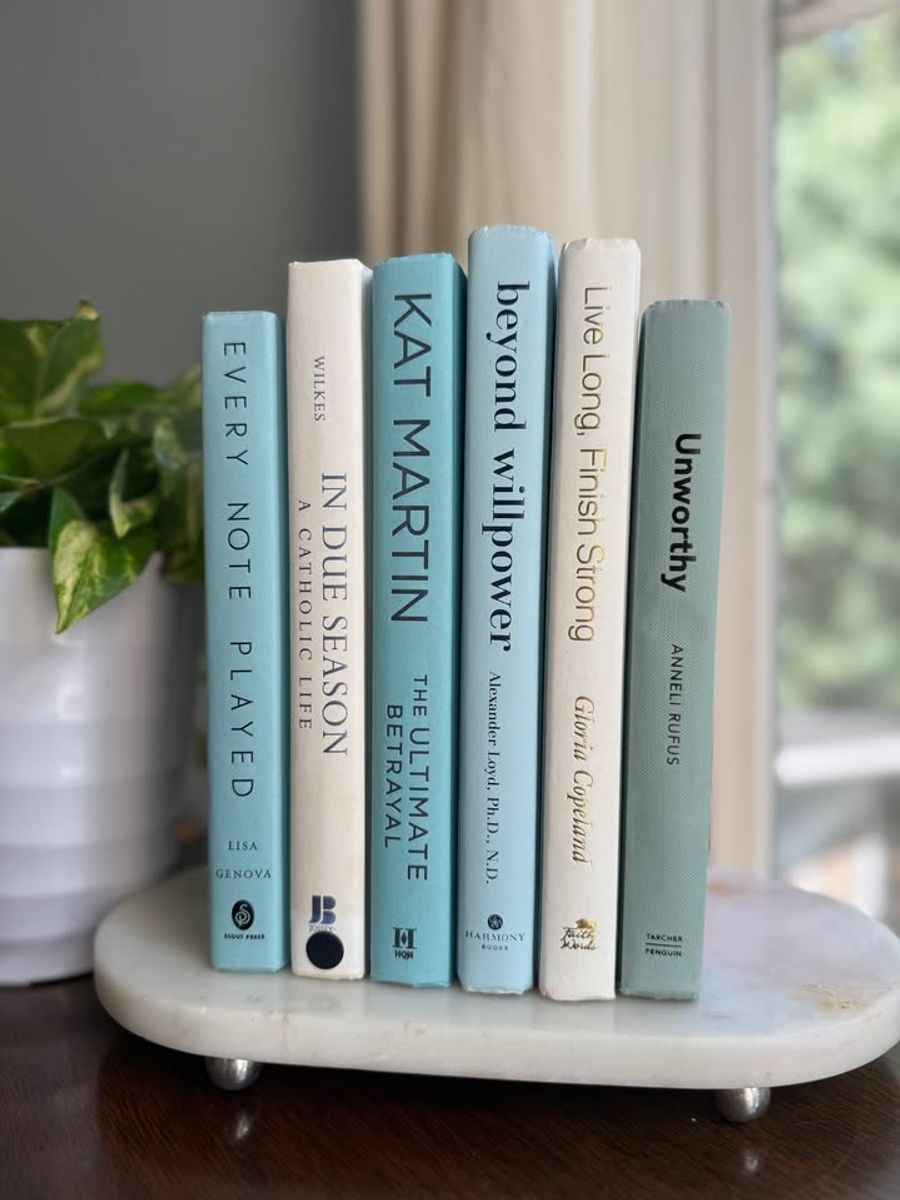 Curated collection of soft blue, aqua, seafoam, and muted coastal-toned books.
