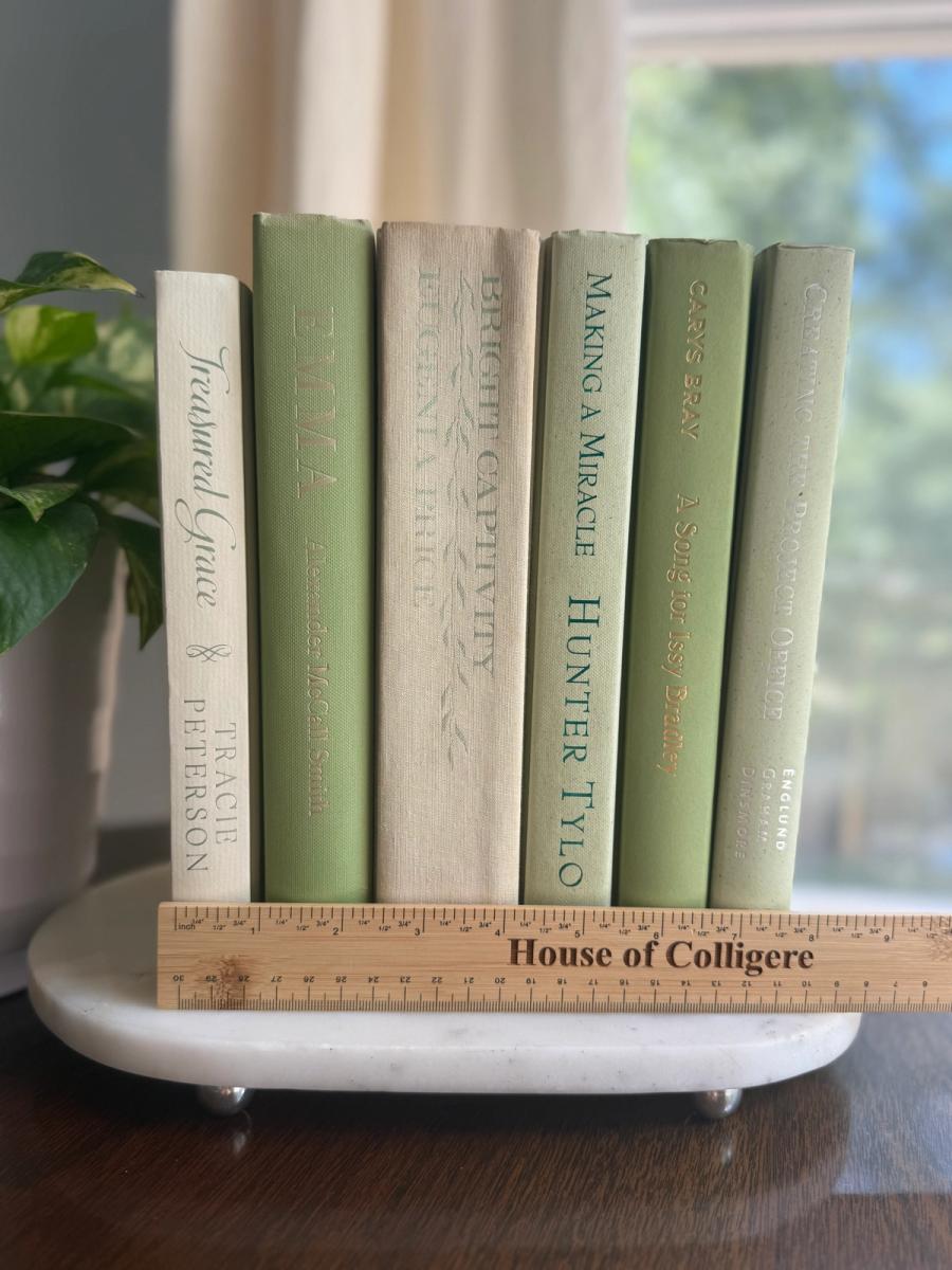 Curated collection of green books ranging from soft sage and olive to deeper botanical tones.