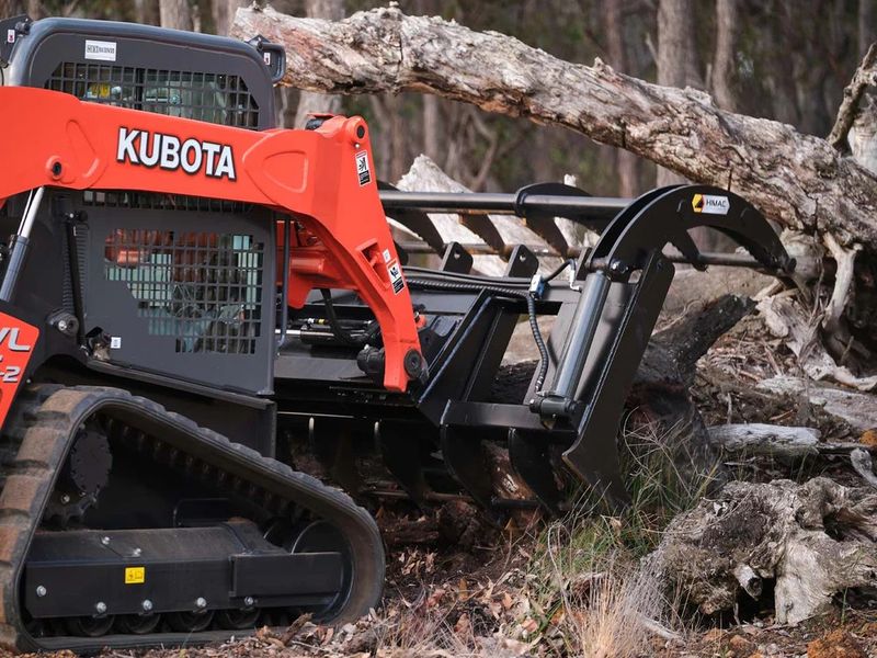 Wood grasp attachment for skid steers