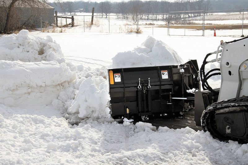 V snow blade attachment for skid steers