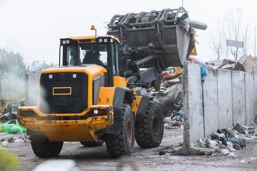 Wood grasp attachment for skid steers