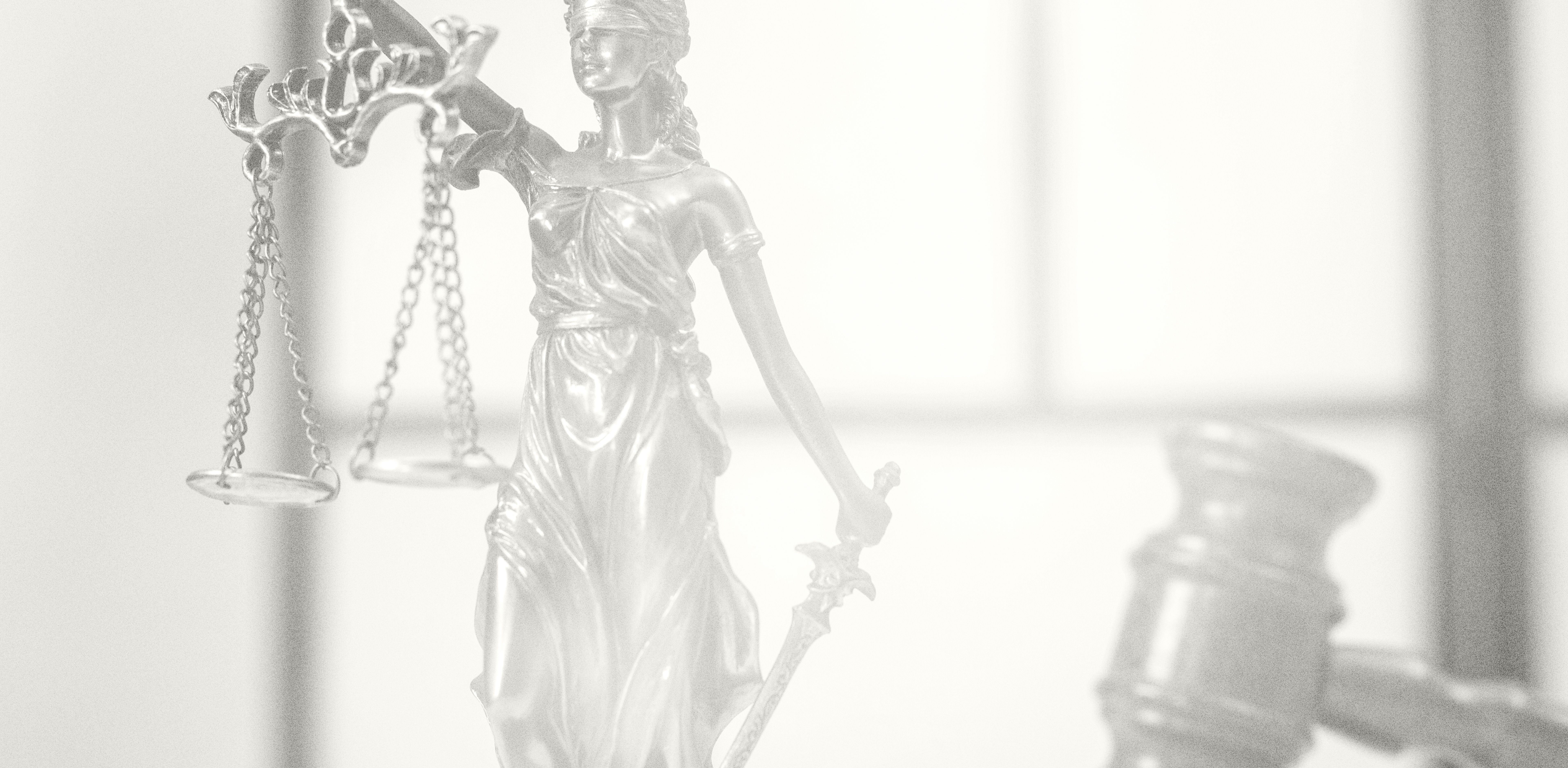Lady Justice statue and gavel