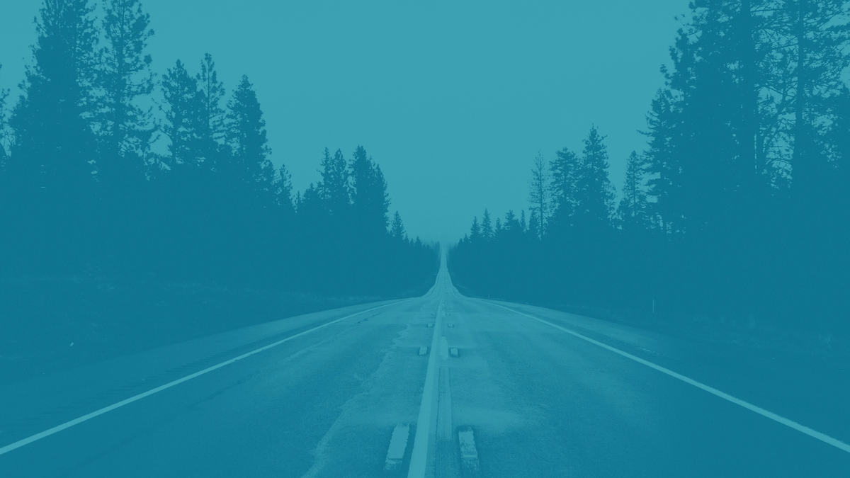 A road leading off into the horizon with a blue overlay