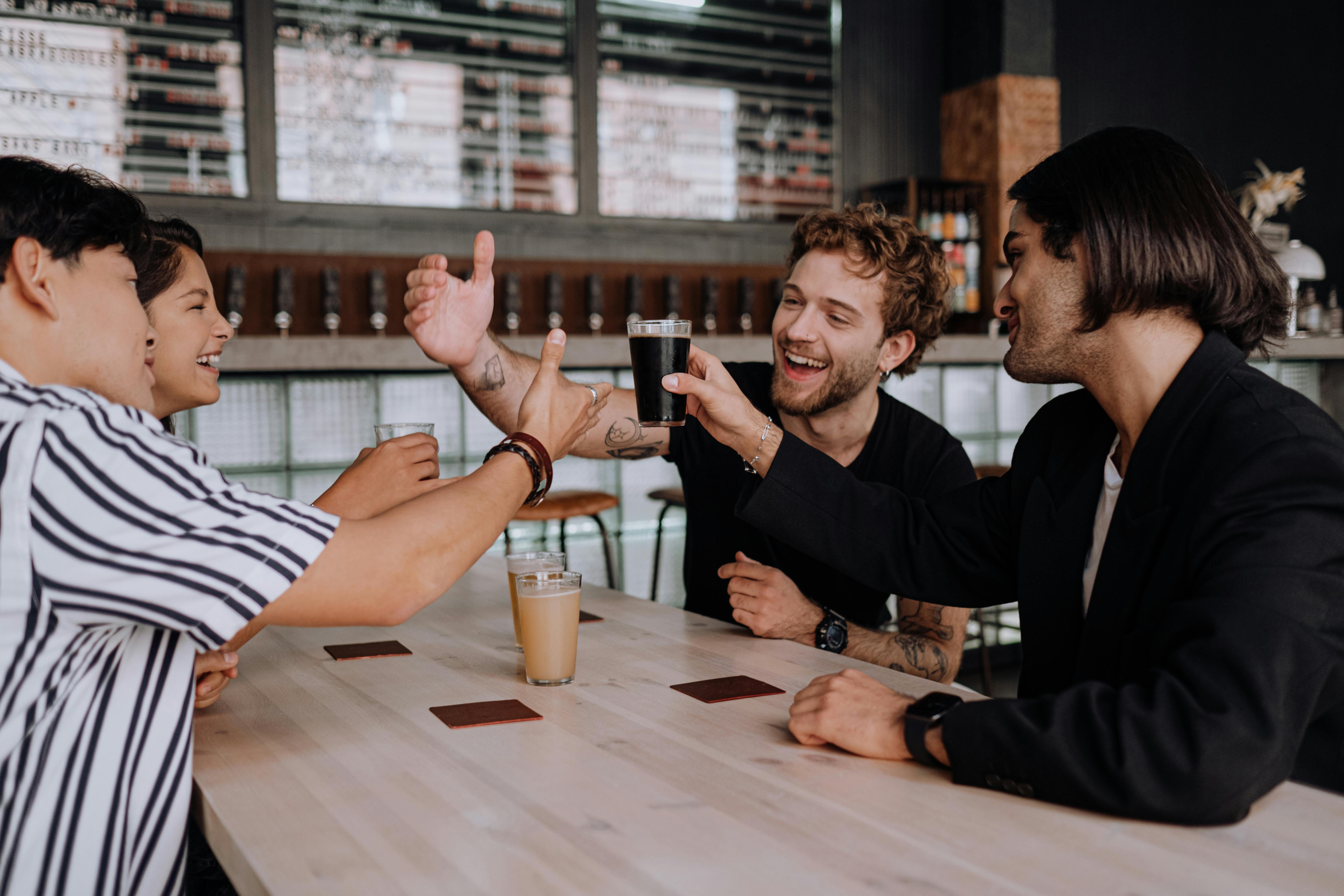 Four friends smiling and making a toast with drinks at a bar.​​​​‌﻿‍﻿​‍​‍‌‍﻿﻿‌﻿​‍‌‍‍‌‌‍‌﻿‌‍‍‌‌‍﻿‍​‍​‍​﻿‍‍​‍​‍‌﻿​﻿‌‍​‌‌‍﻿‍‌‍‍‌‌﻿‌​‌﻿‍‌​‍﻿‍‌‍‍‌‌‍﻿﻿​‍​‍​‍﻿​​‍​‍‌‍‍​‌﻿​‍‌‍‌‌‌‍‌‍​‍​‍​﻿‍‍​‍​‍‌‍‍​‌﻿‌​‌﻿‌​‌﻿​​‌﻿​﻿​﻿‍‍​‍﻿﻿​‍﻿﻿‌‍﻿‌‌‍​‌‌‍​﻿‌‍‍﻿‌‍​‌‌﻿‍‌​‍﻿‌‌‍‌﻿‌‍﻿﻿‌‍﻿﻿‌‍‌​‌﻿‌﻿‌‍‍‌‌‍﻿‍​‍﻿‍‌﻿​﻿‌‍​‌‌‍﻿‍‌‍‍‌‌﻿‌​‌﻿‍‌​‍﻿‍‌﻿​﻿‌﻿‌​‌﻿‌‌‌‍‌​‌‍‍‌‌‍﻿﻿​‍﻿﻿‌﻿​﻿‌﻿‌​‌﻿‌‌‌‍‌​‌‍‍‌‌‍﻿﻿​‍﻿﻿‌‍‍‌‌‍﻿‍‌﻿‌​‌‍‌‌‌‍﻿‍‌﻿‌​​‍﻿﻿‌‍‌‌‌‍‌​‌‍‍‌‌﻿‌​​‍﻿﻿‌‍﻿‌‌‍﻿﻿‌‍‌​‌‍‌‌​﻿﻿‌‌﻿​​‌﻿​‍‌‍‌‌‌﻿​﻿‌‍‌‌‌‍﻿‍‌﻿‌​‌‍​‌‌﻿‌​‌‍‍‌‌‍﻿﻿‌‍﻿‍​﻿‍﻿‌‍‍‌‌‍‌​​﻿﻿‌​﻿‌‌​﻿‌​‌‍​‍​﻿​‌‌‍​﻿​﻿​‍​﻿‌‍​﻿‍‌​‍﻿‌​﻿​‍‌‍​‍​﻿‌‌​﻿​‌​‍﻿‌​﻿‌​​﻿‌‌‌‍​‍​﻿‍‌​‍﻿‌‌‍​‍​﻿​‍‌‍‌​​﻿​‌​‍﻿‌​﻿‌‍​﻿​‍‌‍‌‌‌‍‌​‌‍‌​​﻿​‍​﻿​​​﻿​‌‌‍‌​​﻿‌​​﻿​﻿‌‍‌‍​﻿‍﻿‌﻿‌​‌﻿‍‌‌﻿​​‌‍‌‌​﻿﻿‌‌﻿​​‌‍﻿﻿‌﻿​﻿‌﻿‌​​﻿‍﻿‌﻿​​‌‍​‌‌﻿‌​‌‍‍​​﻿﻿‌‌‍‍‌‌‍﻿‌‌‍​‌‌‍‌﻿‌‍‌‌​‍﻿‍‌‍​‌‌‍﻿​‌﻿‌​​﻿﻿﻿‌‍​‍‌‍​‌‌﻿​﻿‌‍‌‌‌‌‌‌‌﻿​‍‌‍﻿​​﻿﻿‌‌‍‍​‌﻿‌​‌﻿‌​‌﻿​​‌﻿​﻿​‍‌‌​﻿​﻿‌​​‌​‍‌‌​﻿​‍‌​‌‍​‍‌‌​﻿​‍‌​‌‍‌‍﻿‌‌‍​‌‌‍​﻿‌‍‍﻿‌‍​‌‌﻿‍‌​‍﻿‌‌‍‌﻿‌‍﻿﻿‌‍﻿﻿‌‍‌​‌﻿‌﻿‌‍‍‌‌‍﻿‍​‍﻿‍‌﻿​﻿‌‍​‌‌‍﻿‍‌‍‍‌‌﻿‌​‌﻿‍‌​‍﻿‍‌﻿​﻿‌﻿‌​‌﻿‌‌‌‍‌​‌‍‍‌‌‍﻿﻿​‍‌‌​﻿​‍‌​‌‍‌﻿​﻿‌﻿‌​‌﻿‌‌‌‍‌​‌‍‍‌‌‍﻿﻿​‍‌‍‌‍‍‌‌‍‌​​﻿﻿‌​﻿‌‌​﻿‌​‌‍​‍​﻿​‌‌‍​﻿​﻿​‍​﻿‌‍​﻿‍‌​‍﻿‌​﻿​‍‌‍​‍​﻿‌‌​﻿​‌​‍﻿‌​﻿‌​​﻿‌‌‌‍​‍​﻿‍‌​‍﻿‌‌‍​‍​﻿​‍‌‍‌​​﻿​‌​‍﻿‌​﻿‌‍​﻿​‍‌‍‌‌‌‍‌​‌‍‌​​﻿​‍​﻿​​​﻿​‌‌‍‌​​﻿‌​​﻿​﻿‌‍‌‍​‍‌‍‌﻿‌​‌﻿‍‌‌﻿​​‌‍‌‌​﻿﻿‌‌﻿​​‌‍﻿﻿‌﻿​﻿‌﻿‌​​‍‌‍‌﻿​​‌‍​‌‌﻿‌​‌‍‍​​﻿﻿‌‌‍‍‌‌‍﻿‌‌‍​‌‌‍‌﻿‌‍‌‌​‍﻿‍‌‍​‌‌‍﻿​‌﻿‌​​‍‌‍‌﻿​​‌‍‌‌‌﻿​‍‌﻿​﻿‌﻿​​‌‍‌‌‌‍​﻿‌﻿‌​‌‍‍‌‌﻿‌‍‌‍‌‌​﻿﻿‌‌﻿​​‌﻿‌‌‌‍​‍‌‍﻿​‌‍‍‌‌﻿​﻿‌‍‍​‌‍‌‌‌‍‌​​‍​‍‌﻿﻿‌