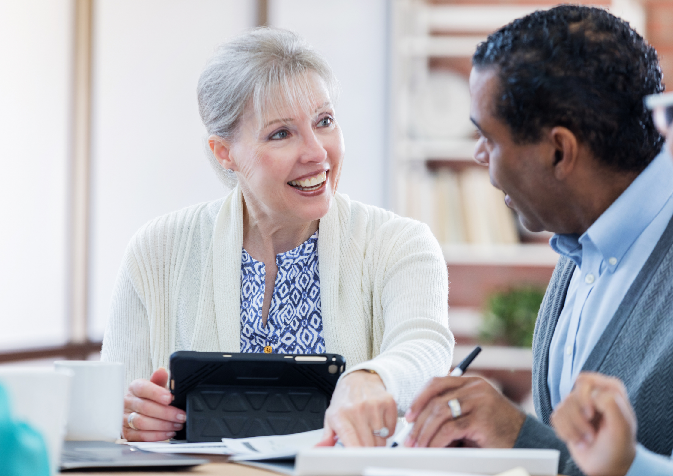 A smiling older woman with a tablet looks at an older Black man who is looking at documents.​​​​‌﻿‍﻿​‍​‍‌‍﻿﻿‌﻿​‍‌‍‍‌‌‍‌﻿‌‍‍‌‌‍﻿‍​‍​‍​﻿‍‍​‍​‍‌﻿​﻿‌‍​‌‌‍﻿‍‌‍‍‌‌﻿‌​‌﻿‍‌​‍﻿‍‌‍‍‌‌‍﻿﻿​‍​‍​‍﻿​​‍​‍‌‍‍​‌﻿​‍‌‍‌‌‌‍‌‍​‍​‍​﻿‍‍​‍​‍‌‍‍​‌﻿‌​‌﻿‌​‌﻿​​‌﻿​﻿​﻿‍‍​‍﻿﻿​‍﻿﻿‌‍﻿‌‌‍​‌‌‍​﻿‌‍‍﻿‌‍​‌‌﻿‍‌​‍﻿‌‌‍‌﻿‌‍﻿﻿‌‍﻿﻿‌‍‌​‌﻿‌﻿‌‍‍‌‌‍﻿‍​‍﻿‍‌﻿​﻿‌‍​‌‌‍﻿‍‌‍‍‌‌﻿‌​‌﻿‍‌​‍﻿‍‌﻿​﻿‌﻿‌​‌﻿‌‌‌‍‌​‌‍‍‌‌‍﻿﻿​‍﻿﻿‌﻿​﻿‌﻿‌​‌﻿‌‌‌‍‌​‌‍‍‌‌‍﻿﻿​‍﻿﻿‌‍‍‌‌‍﻿‍‌﻿‌​‌‍‌‌‌‍﻿‍‌﻿‌​​‍﻿﻿‌‍‌‌‌‍‌​‌‍‍‌‌﻿‌​​‍﻿﻿‌‍﻿‌‌‍﻿﻿‌‍‌​‌‍‌‌​﻿﻿‌‌﻿​​‌﻿​‍‌‍‌‌‌﻿​﻿‌‍‌‌‌‍﻿‍‌﻿‌​‌‍​‌‌﻿‌​‌‍‍‌‌‍﻿﻿‌‍﻿‍​﻿‍﻿‌‍‍‌‌‍‌​​﻿﻿‌‌‍​‌‌‍‌‍​﻿​‍‌‍‌‍‌‍​﻿​﻿​‌​﻿‍‌‌‍​‍​‍﻿‌‌‍‌‌​﻿​﻿​﻿‍​‌‍​‍​‍﻿‌​﻿‌​‌‍‌‍​﻿​‌​﻿‍​​‍﻿‌‌‍​‍‌‍‌‌​﻿‌‌​﻿‌​​‍﻿‌​﻿‌﻿‌‍‌​​﻿​‍​﻿‍‌‌‍‌‌‌‍​‌​﻿​​​﻿​​​﻿‌﻿​﻿​‍​﻿‌‍​﻿‌‌​﻿‍﻿‌﻿‌​‌﻿‍‌‌﻿​​‌‍‌‌​﻿﻿‌‌﻿​​‌‍﻿﻿‌﻿​﻿‌﻿‌​​﻿‍﻿‌﻿​​‌‍​‌‌﻿‌​‌‍‍​​﻿﻿‌‌‍‍‌‌‍﻿‌‌‍​‌‌‍‌﻿‌‍‌‌​‍﻿‍‌‍​‌‌‍﻿​‌﻿‌​​﻿﻿﻿‌‍​‍‌‍​‌‌﻿​﻿‌‍‌‌‌‌‌‌‌﻿​‍‌‍﻿​​﻿﻿‌‌‍‍​‌﻿‌​‌﻿‌​‌﻿​​‌﻿​﻿​‍‌‌​﻿​﻿‌​​‌​‍‌‌​﻿​‍‌​‌‍​‍‌‌​﻿​‍‌​‌‍‌‍﻿‌‌‍​‌‌‍​﻿‌‍‍﻿‌‍​‌‌﻿‍‌​‍﻿‌‌‍‌﻿‌‍﻿﻿‌‍﻿﻿‌‍‌​‌﻿‌﻿‌‍‍‌‌‍﻿‍​‍﻿‍‌﻿​﻿‌‍​‌‌‍﻿‍‌‍‍‌‌﻿‌​‌﻿‍‌​‍﻿‍‌﻿​﻿‌﻿‌​‌﻿‌‌‌‍‌​‌‍‍‌‌‍﻿﻿​‍‌‌​﻿​‍‌​‌‍‌﻿​﻿‌﻿‌​‌﻿‌‌‌‍‌​‌‍‍‌‌‍﻿﻿​‍‌‍‌‍‍‌‌‍‌​​﻿﻿‌‌‍​‌‌‍‌‍​﻿​‍‌‍‌‍‌‍​﻿​﻿​‌​﻿‍‌‌‍​‍​‍﻿‌‌‍‌‌​﻿​﻿​﻿‍​‌‍​‍​‍﻿‌​﻿‌​‌‍‌‍​﻿​‌​﻿‍​​‍﻿‌‌‍​‍‌‍‌‌​﻿‌‌​﻿‌​​‍﻿‌​﻿‌﻿‌‍‌​​﻿​‍​﻿‍‌‌‍‌‌‌‍​‌​﻿​​​﻿​​​﻿‌﻿​﻿​‍​﻿‌‍​﻿‌‌​‍‌‍‌﻿‌​‌﻿‍‌‌﻿​​‌‍‌‌​﻿﻿‌‌﻿​​‌‍﻿﻿‌﻿​﻿‌﻿‌​​‍‌‍‌﻿​​‌‍​‌‌﻿‌​‌‍‍​​﻿﻿‌‌‍‍‌‌‍﻿‌‌‍​‌‌‍‌﻿‌‍‌‌​‍﻿‍‌‍​‌‌‍﻿​‌﻿‌​​‍‌‍‌﻿​​‌‍‌‌‌﻿​‍‌﻿​﻿‌﻿​​‌‍‌‌‌‍​﻿‌﻿‌​‌‍‍‌‌﻿‌‍‌‍‌‌​﻿﻿‌‌﻿​​‌﻿‌‌‌‍​‍‌‍﻿​‌‍‍‌‌﻿​﻿‌‍‍​‌‍‌‌‌‍‌​​‍​‍‌﻿﻿‌
